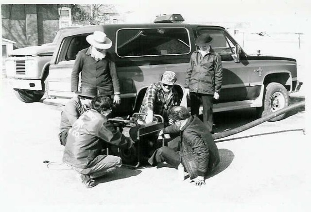 The firemen service the portable pump in 1985.